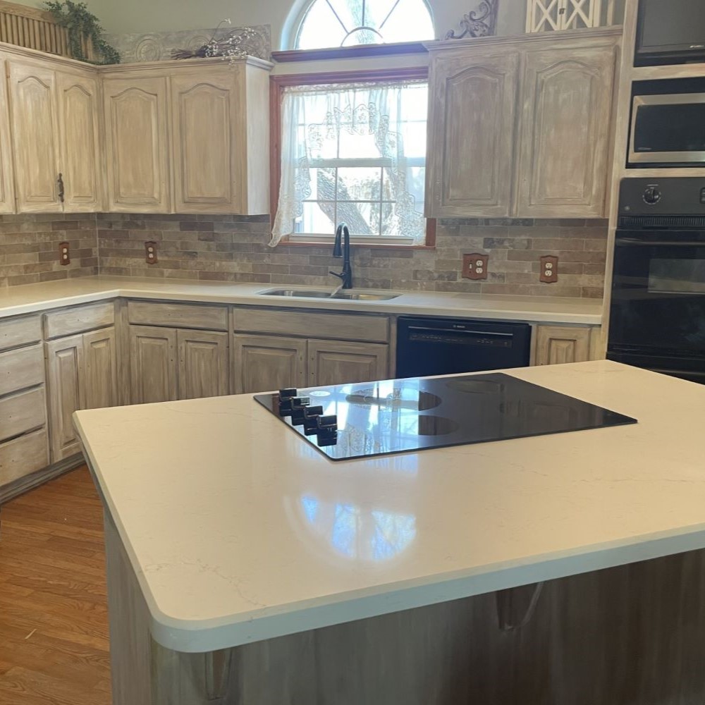 Kitchen countertop with island and range. 